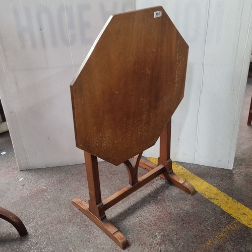 488 - Octagonal wooden pop up side table with pedestal base and curved supports, from the mid-20th century... 