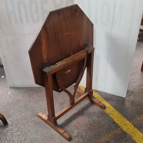 488 - Octagonal wooden pop up side table with pedestal base and curved supports, from the mid-20th century... 