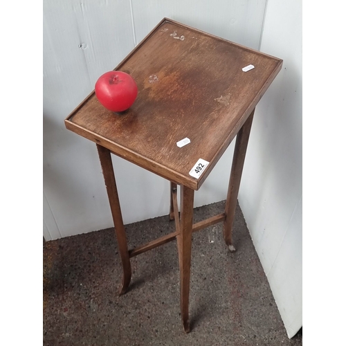 492 - Vintage wooden side table with slender legs and a rectangular top.