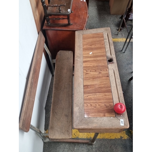 497 - Vintage school desk with attached bench, featuring a wooden writing surface and metal legs. Classic ... 