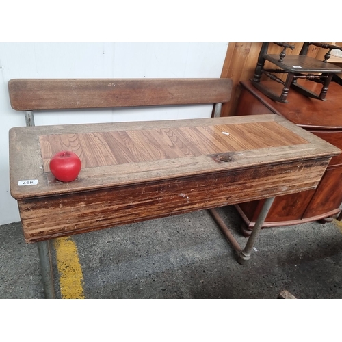 497 - Vintage school desk with attached bench, featuring a wooden writing surface and metal legs. Classic ... 