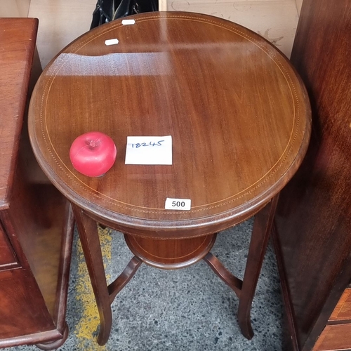 500 - Mahogany round  side table with round top and lower shelf, featuring delicately inlaid detailing.