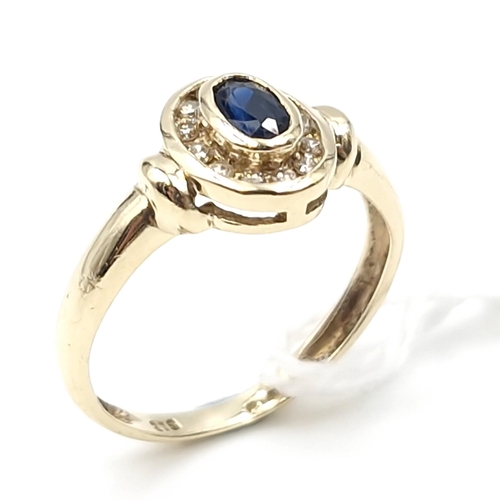 2 - Star lot : A nice example of a nine carat gold diamond and sapphire ring. Ring size - K. Weight - 1.... 