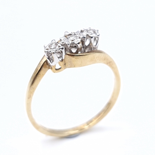 22 - A nine carat gold three stone diamond ring. Ring size - N. Weight - 1.8 grams. Boxed.