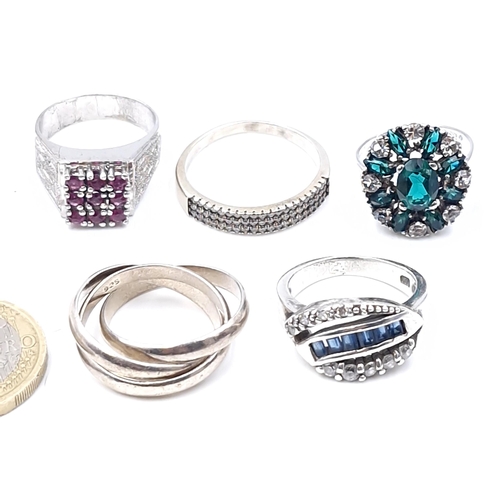 28 - A collection of five rings - mostly silver & some gem set together with a three link ring. Sizes L -... 