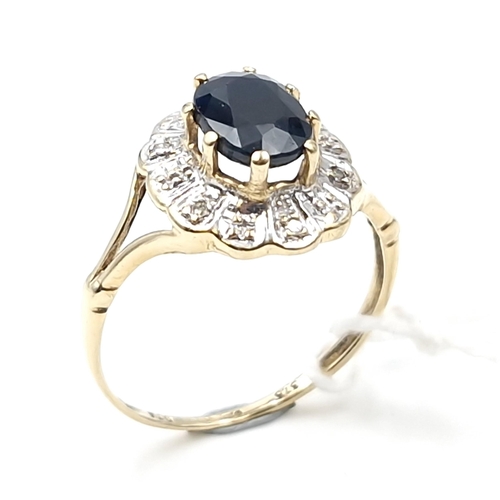 3 - Star Lot : A fine example of a large sapphire stone ring with diamond cluster surround set in nine c... 