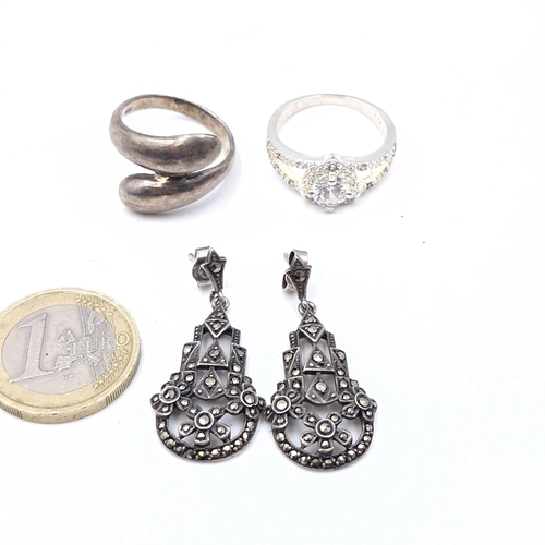 30 - Three jewellery items consisting of a two silver hallmarked rings one in the form a gem set heart. A... 