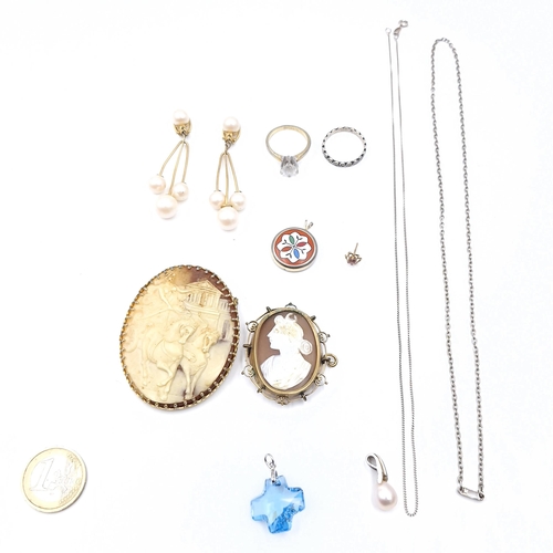 31 - A collection of jewellery items consisting of two rings. Size - O. Together with two cameo brooches ... 