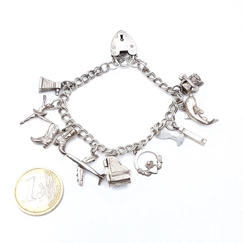 45 - A sterling silver 10 charm bracelet set with padlock clasp and safety chain. Total weight - 25.27 gr... 