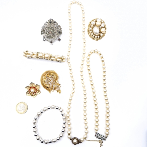 50 - An assorted collection of costume jewellery consisting of four brooches - pins intact. A pearl hair ... 