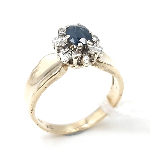 7 - Star lot : A nine carat gold diamond and sapphire stone ring with wide band mount. Size - L. Weight ... 