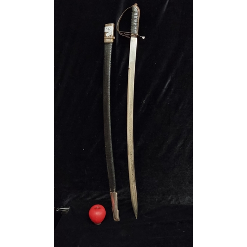 107 - A great example of an Indian talwar sword with a hand guard, etched blade and original sheath.