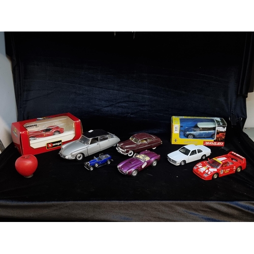 111 - Eight die cast model cars including a Burago Ferrari Testa Rossa (19570 metal model of a 1:24 scale,... 