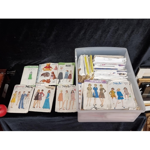 129 - À box containing a very large collection of vintage sewing patterns including bridal, lifestyle ward... 