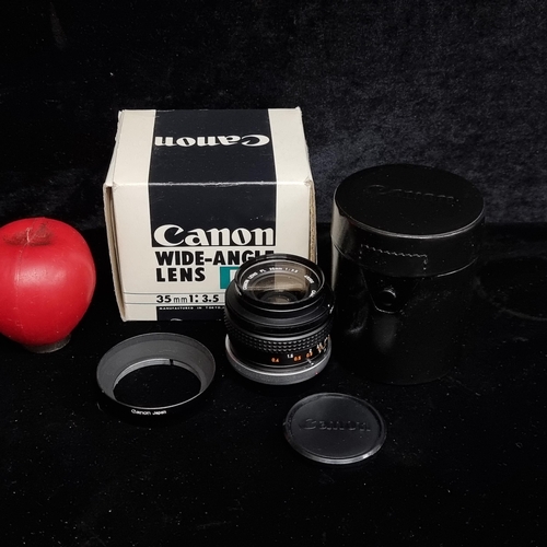 130 - A new old stock Canon FL wide angle lens 35mm 1:3.5 with case and original packaging included. In ne... 