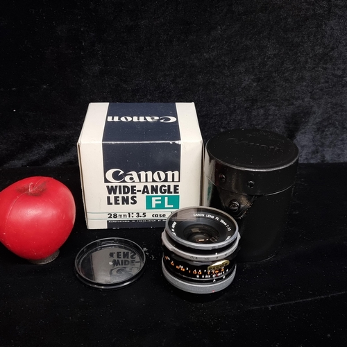 132 - A new old Stock Canon FL wide angle lens 28mm 1:3.5 with case and original packaging included. Used ... 