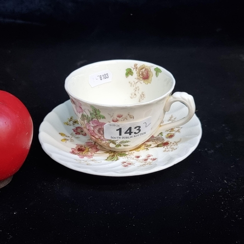 143 - Two vintage pieces of ceramic including a tea cup by Clarice Cliff and a Royal Staffordshire saucer ... 