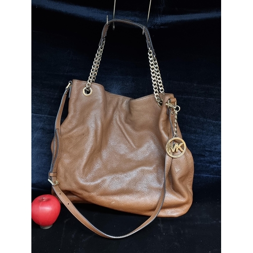 146 - A gorgeous original  ladies designer Michael Kors tan leather handbag.