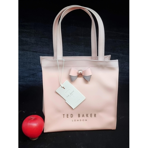 148 - A beautiful brand new stylish ladies Ted Baker Lock Bow Icon handbag. Complete with tags. RRP €60.00... 