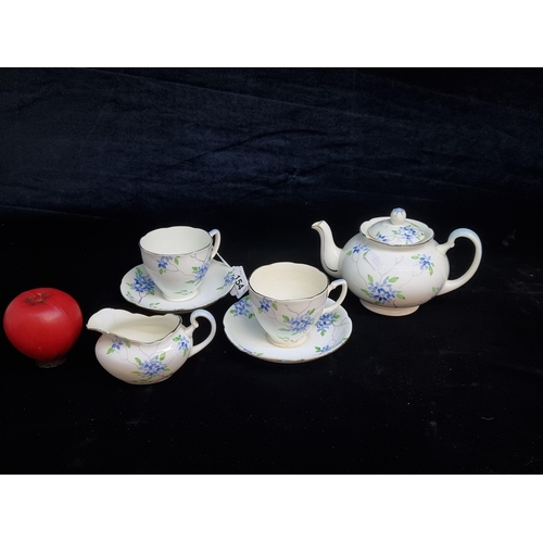 154 - A lovely six piece hand painted Grafton China tea set comprising of a two cups and saucers, milk jug... 