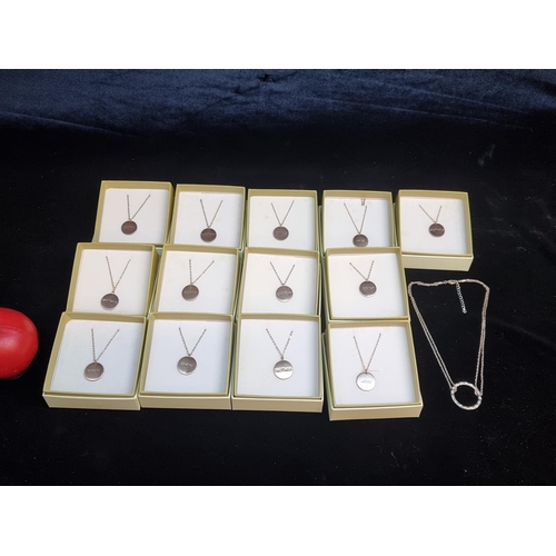 157 - A box containing a selection of rose gold toned Belle & Beau astrology themed necklaces. New in box,... 