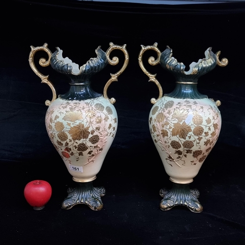 161 - A pair of vintage ceramic mantle vases boasting gorgeous gilt hand painted floral decoration. One ha... 