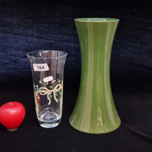 164 - Two items including a tall green English studio pottery vase along with a further hand painted glass... 