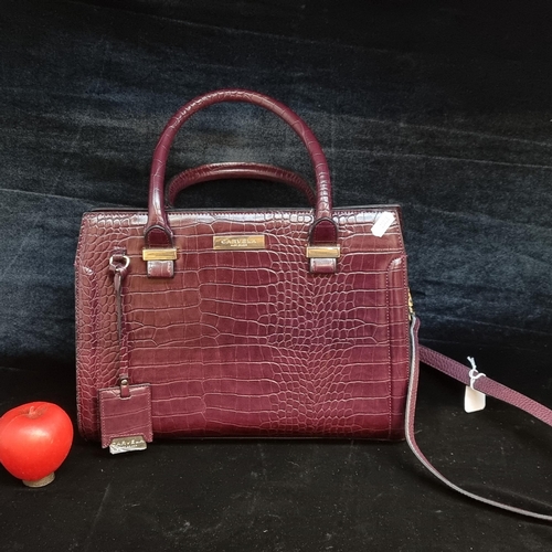 172 - A fabulously stylish ladies Carvela by Kurt Geiger maroon coloured handbag. Complete with long shoul... 