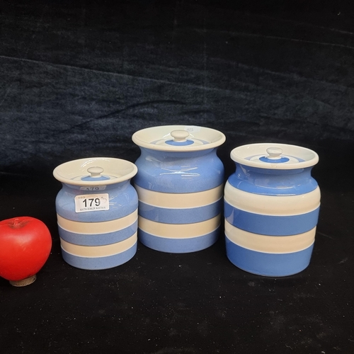 179 - A fantastic trio of graduating TG Greene Cornish Ware lidded jars in the iconic blue and white colou... 