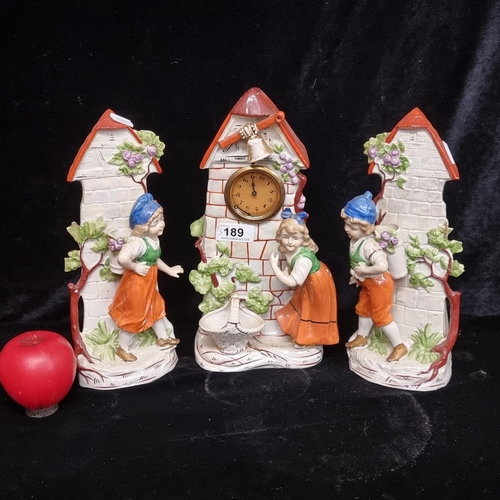 189 - Three vintage nicely detailed German themed ceramics including a clock and two matching garnitures.