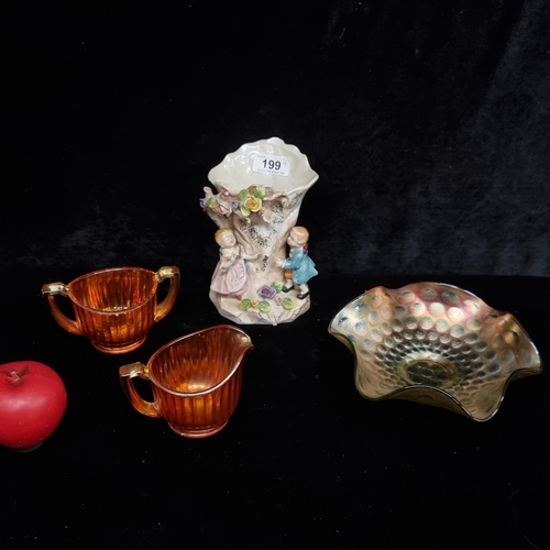 199 - A mixed lot including a porcelain Victorian style vase stamped U-31 to base, together with Marigold ... 