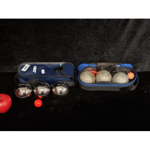 200 - Two sets of Obut Pétanque Boules games, with jacks and carry cases.