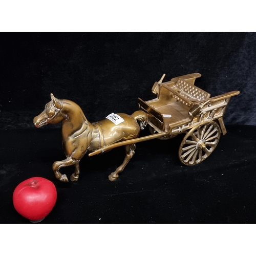 202 - A heavy vintage solid brass horse and carriage.