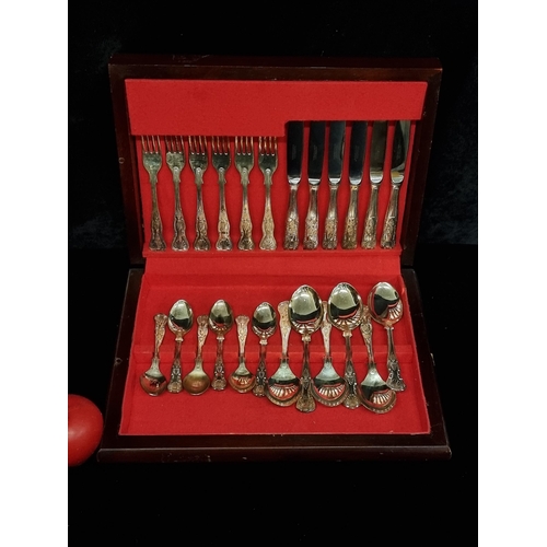 203 - A vintage Newbridge canteen set including forks, spoons and knives in a wooden box.