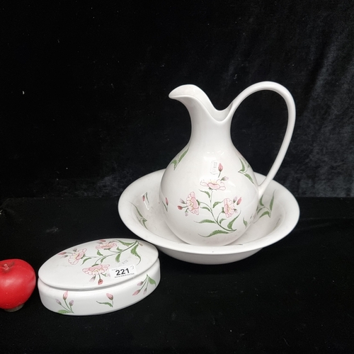 221 - An elegant set of three ceramic items. Includes a jewellery box with lid, wash basin and jug. Featur... 