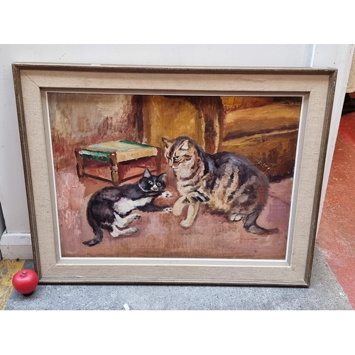 254 - A charming large original oil on canvas painting. Features two playful cats in a cozy home. Rendered... 