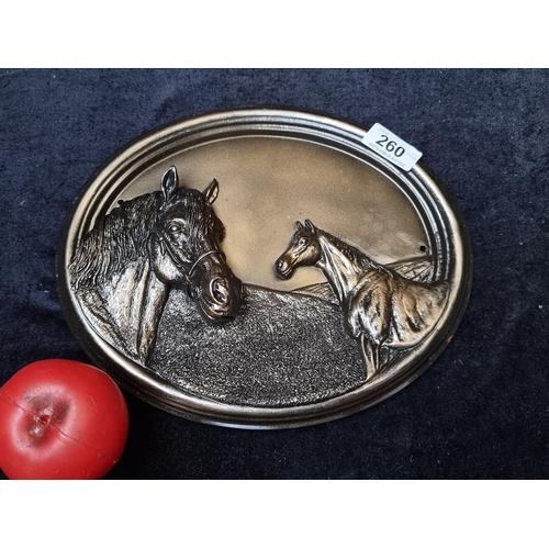 260 - An equestrian themed wall plaque with horse heads.