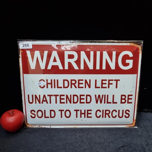 266 - A printed metal wall sign reading 'Warning - Children left unattended will be sold to the circus'.