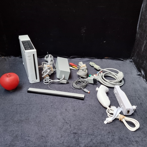 274 - A Nintendo Wii with two controllers and cables.