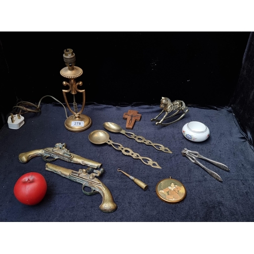 278 - An interesting mixed lot of brass items including a WWI trench art bullet button hook and a dainty b... 