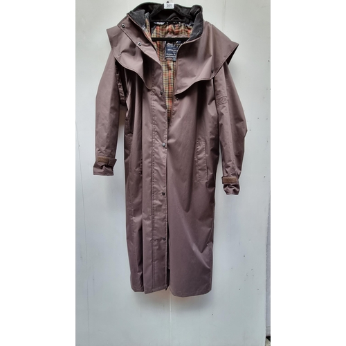 301 - A classic Jack Murphy full length waterproof coat. With heritage check lining. In good condition. Si... 