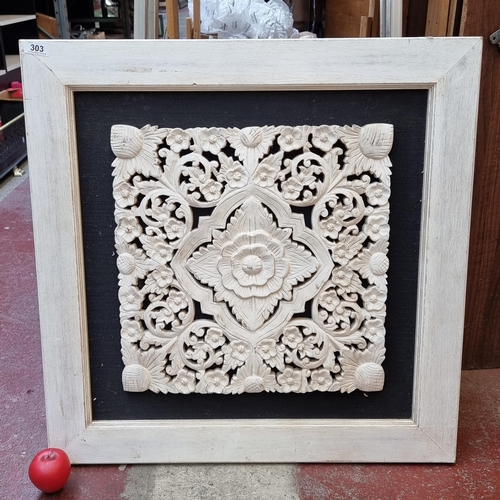 303 - An intricately hand carved wooden panel wall hanging in rustic white finish. Features floral design.... 