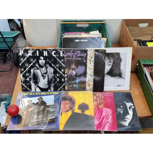 304 - 30 plus vinyl record albums from artists such as Prince x 2, John Lennon, Kate bush Rod Stewart x 2,... 