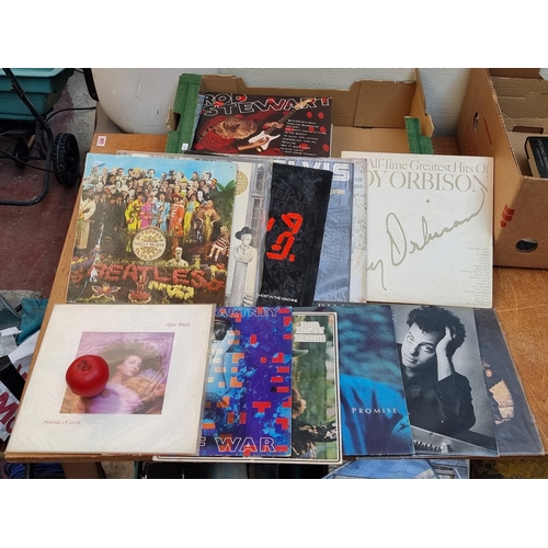 306 - 30 vinyl record albums including classics such as the Beatles 'Sgt Peppers Lonely Hearts Club', The ... 