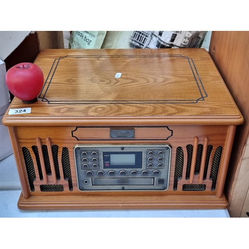 324 - A classic collection edition record player cd cassette player (tapes) and radio with remote control.