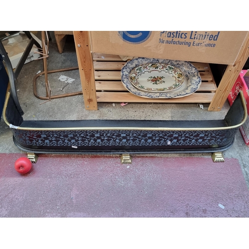 327 - Star Lot : A very handsome  vintage brass fire surround with lion paw feet. MM: 109cm