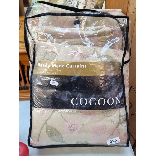 328 - An as new pack containing Coccoon ready made curtains. Fully lined. MM: 90