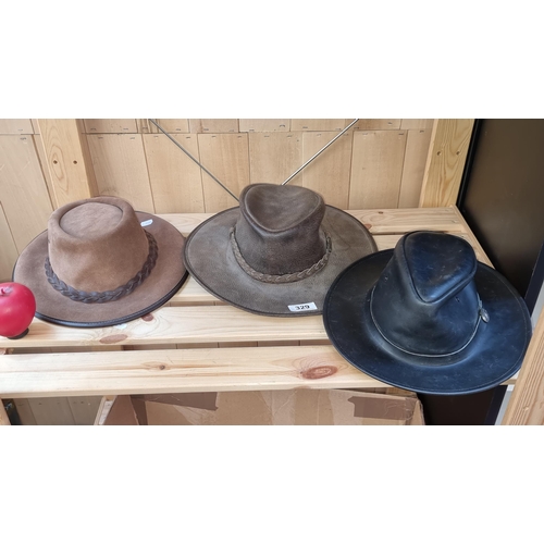 329 - Three leather cowboy hats including two Australian examples Overlander and Kadaku, and a Morgado Spa... 