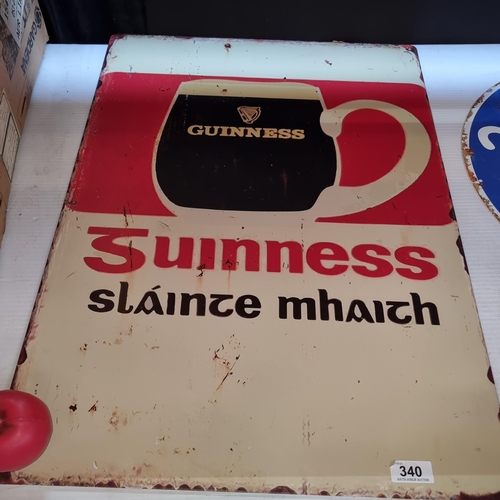 340 - A large metal wall sign advertising Guinness.