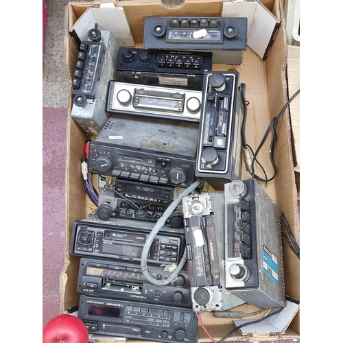 344 - A large box containing vintage car radios.